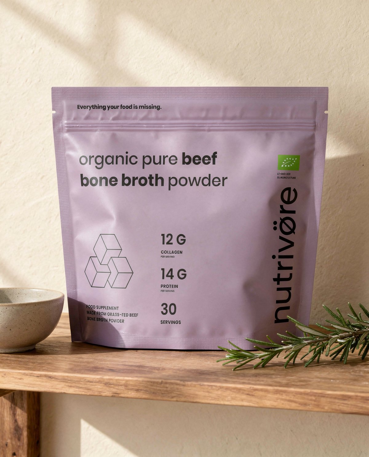 Nutriø̈tēca Bone Broth pouch on a kitchen shelf with rosemary