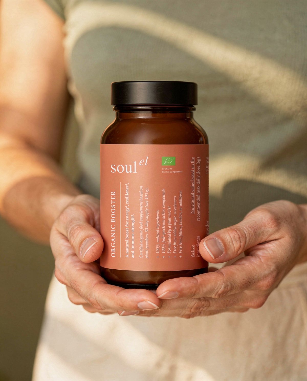 Soulel Organic Booster held in hand
